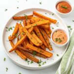 create a perfect view image of a food so that it should look with good presentation and in the image the food should be clearly visible and the central text of food name[Air Fryer Sweet Potato Fries Recipe] standout and extreme.